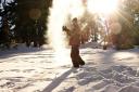  Eric throwing snow into the sunshine.