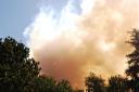  As we were doing our school work smoke clouds billowed over from the next valley.