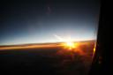  sunset from the plane, three hours till landing.