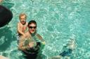 Ian hangin’ on Daddy in the pool!
