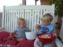 Skyler and Ian hangin’ out and eating popcorn on their new front porch!
